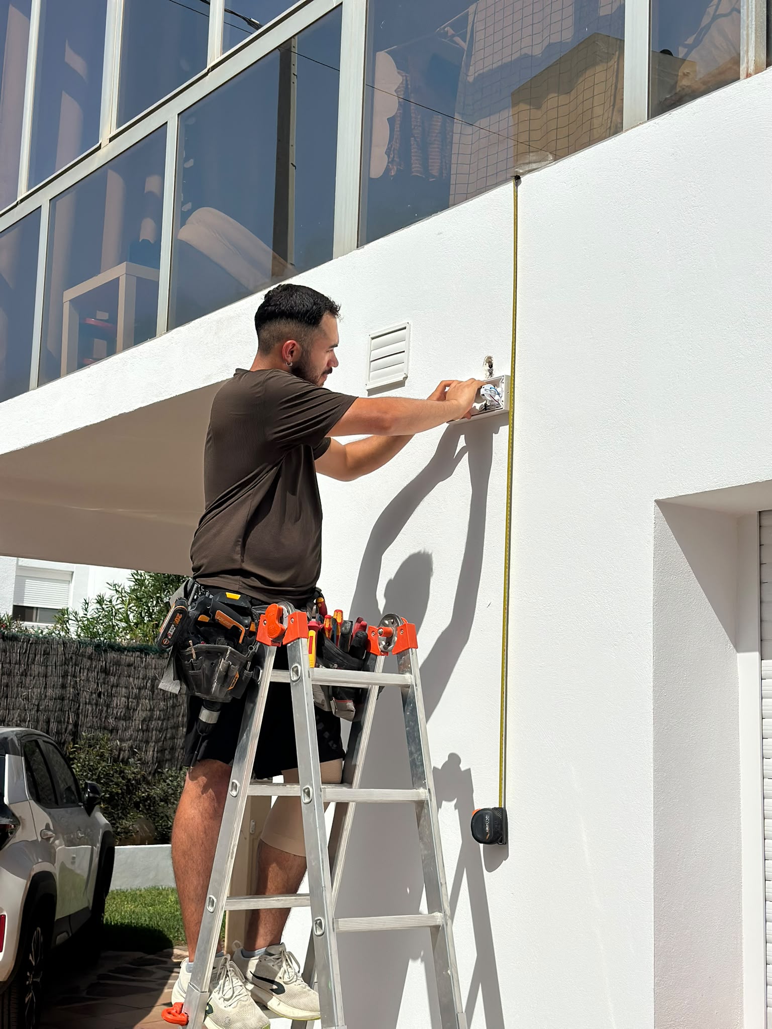 Technician carrying out an outdoor electrical installation